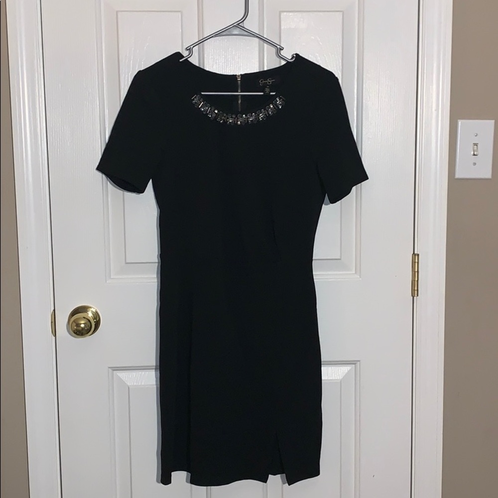 Black sleeved dress with beaded neck line